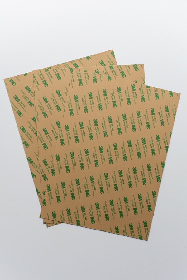 Stack Of Brown Paper With Green Letter